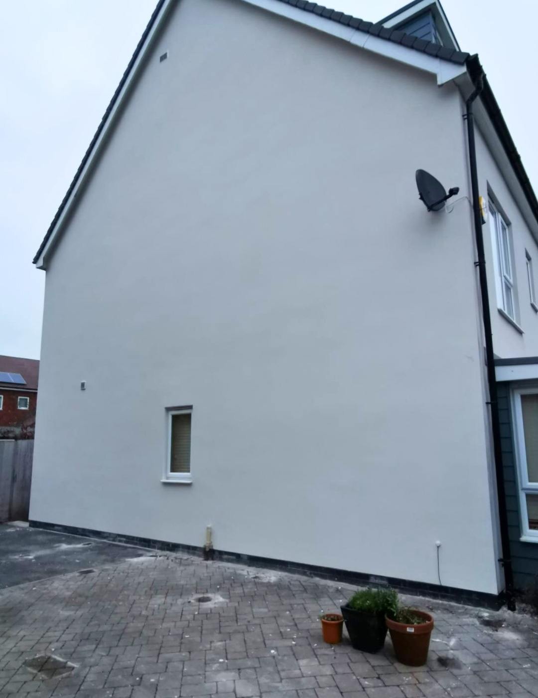 Leicester property after solid wall insulation system and coloured silicone render.
