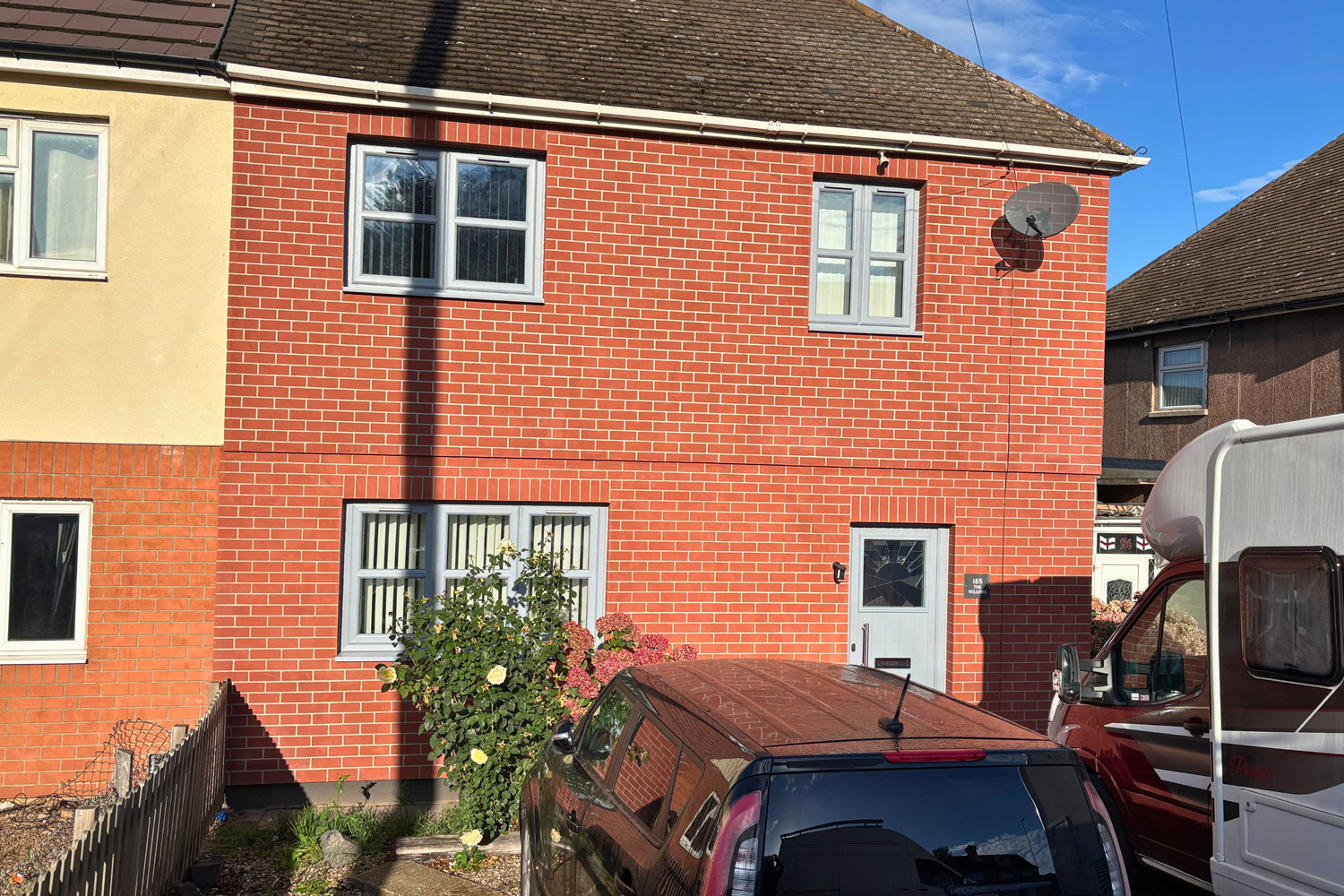 A UK semi-detached house transformed with a highly realistic red brick-effect render over external wall insulation, installed by PD Rendering.