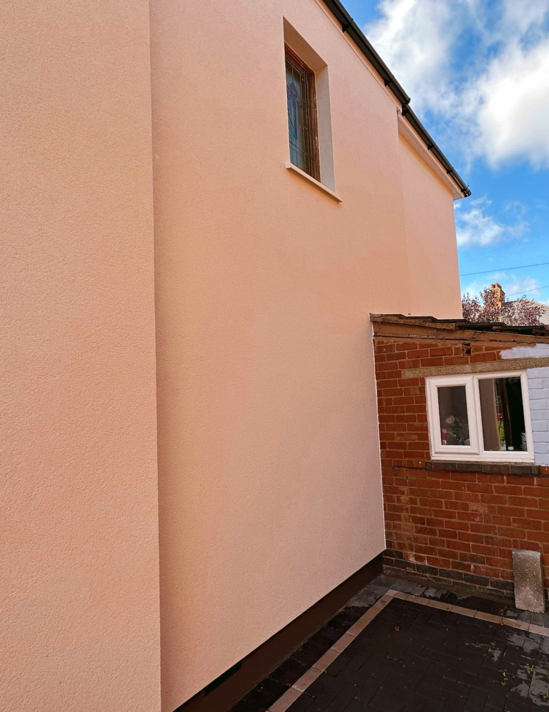 Nuneaton house finished with premium white silicone render and reinforced mesh.