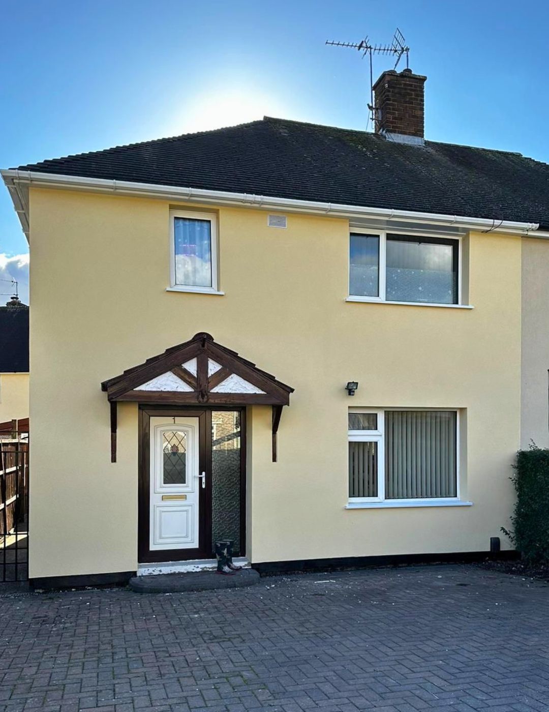 Bedworth semi-detached after pebbledash removal and a cream silicone render finish.
