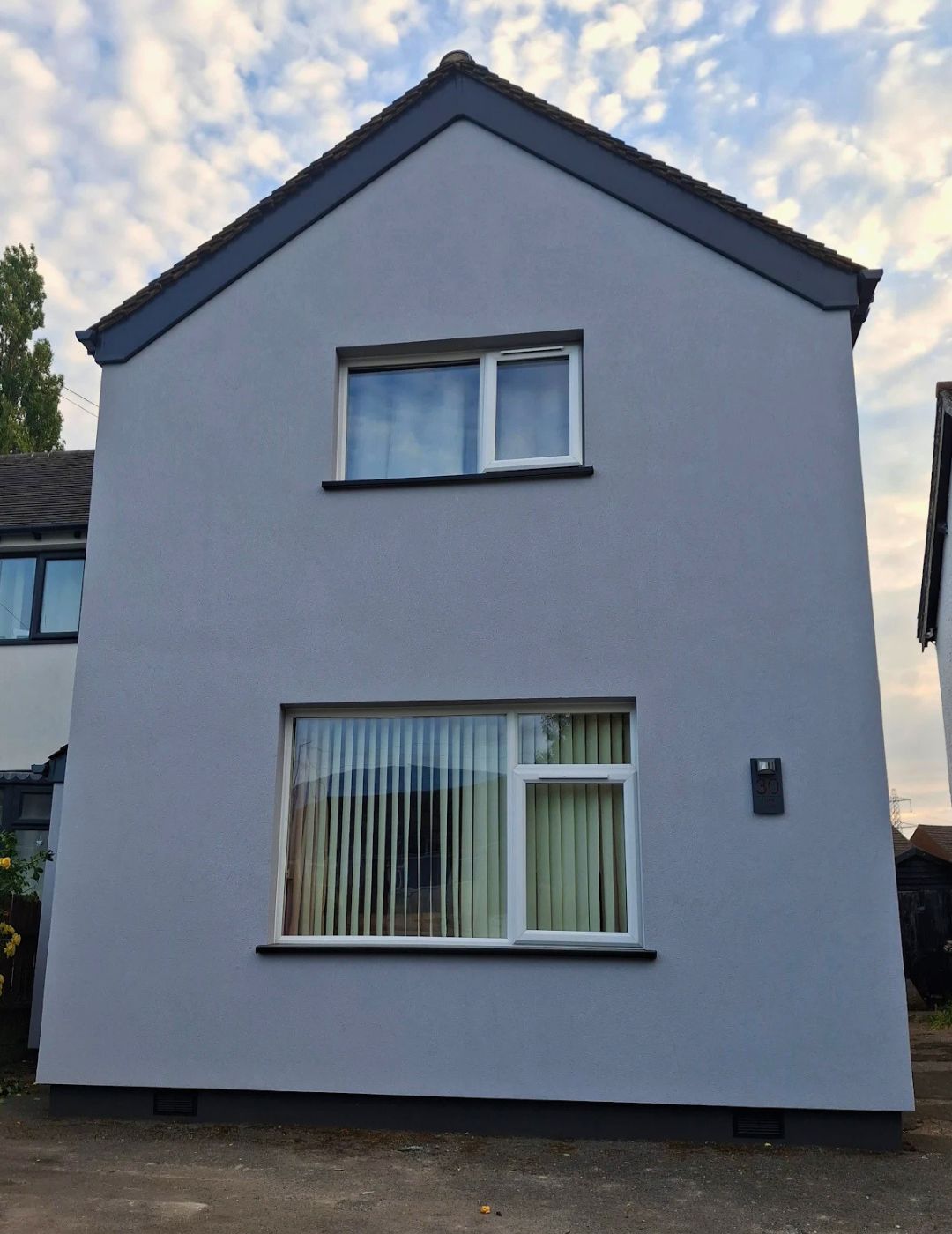 Derby property gable modernised with light grey silicone render and dark trim by PD Rendering
