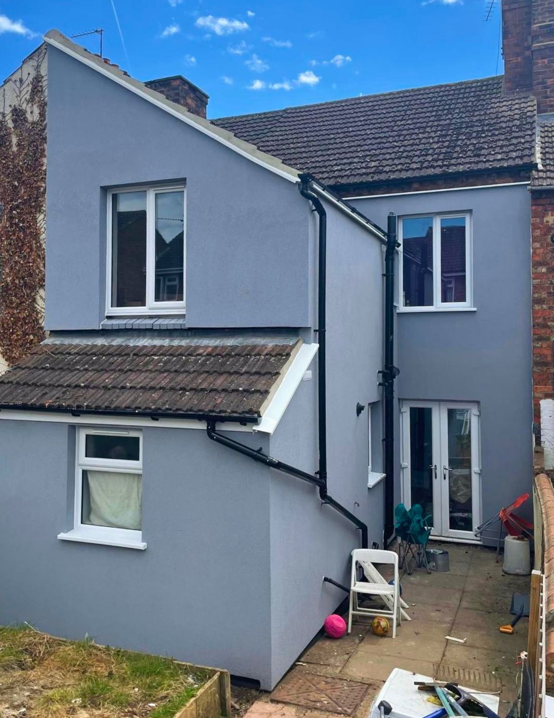 Telford property rear elevation finished in smooth blue-grey silicone render by PD Rendering