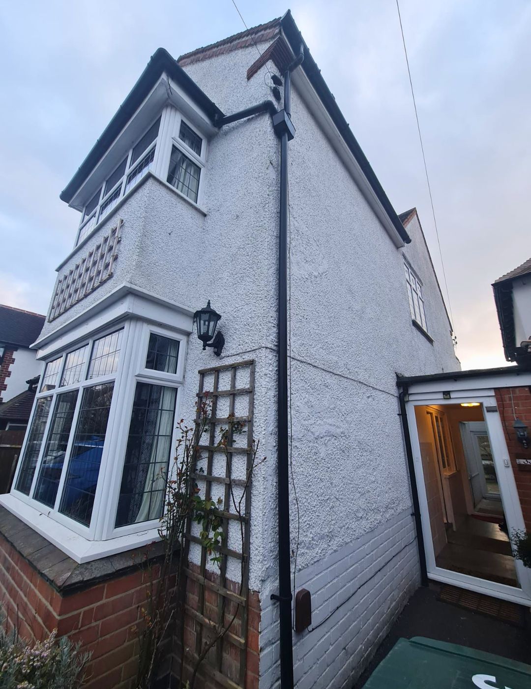 Period detached home in Warwick with tired white pebbledash before render renovation by PD Rendering