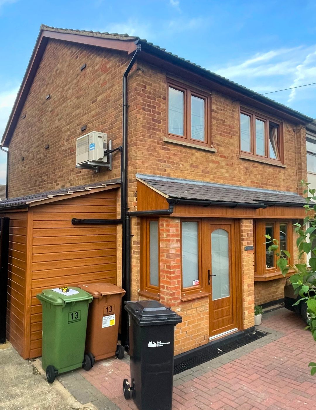 Red brick semi-detached in Wellingborough before cream silicone render transformation by PD Rendering