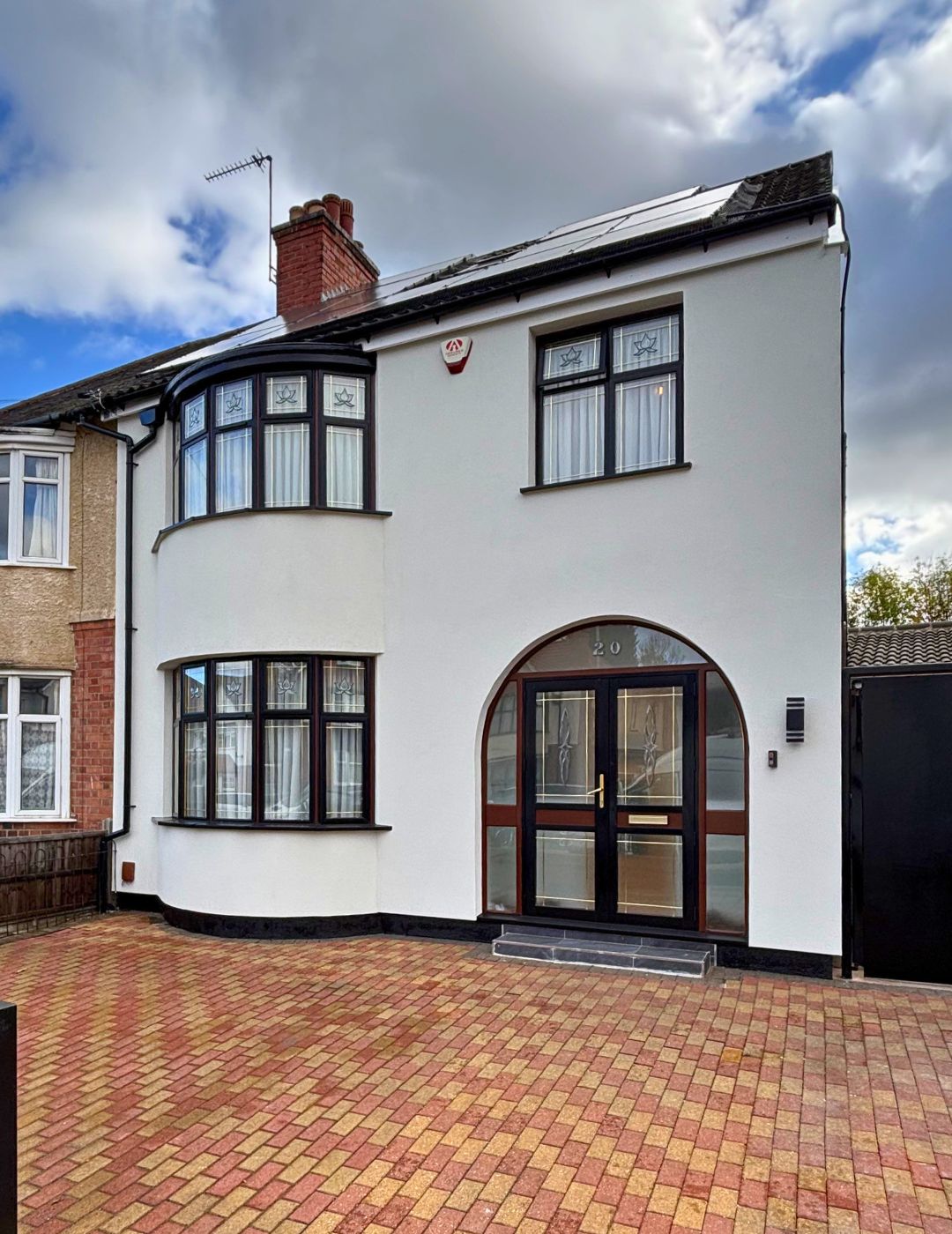 Worcester semi-detached finished in brilliant white silicone render with curved bay by PD Rendering