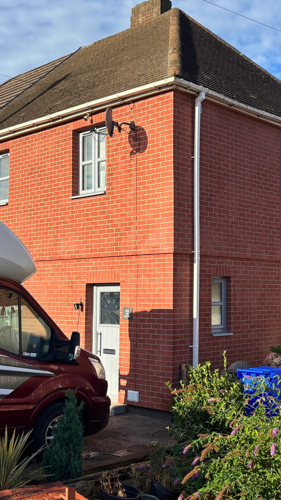 House exterior featuring External Wall Insulation (EWI) finished with a realistic red brick-effect render by PD Rendering.